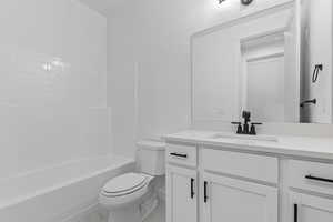 Bathroom with vanity and shower / bath combination