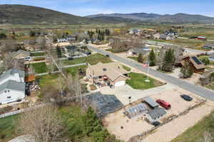 Aerial view of residential area featuring a mountain backdrop