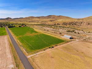 Aerial view of sparsely populated area featuring a mountainous background