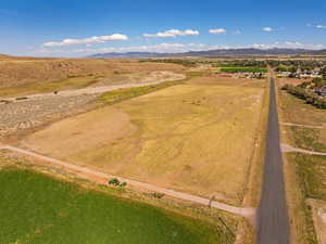 Aerial view of sparsely populated area featuring a mountainous background