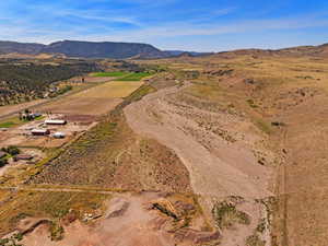 Aerial overview of property's location with mountains and rural landscape