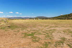 View of mountain background featuring rural landscape
