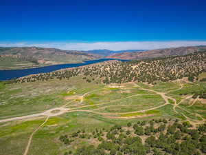 View of property location with a water and mountain view