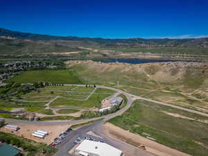 Aerial overview of property's location featuring a water and mountain view