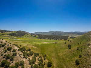 View of mountain backdrop featuring rural landscape