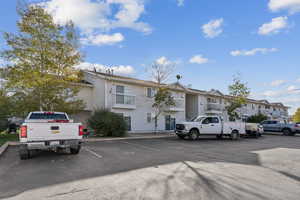 View of front of property featuring uncovered parking and a residential view