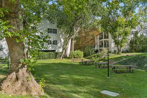 View of home's community featuring a lawn