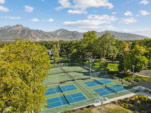 View of tennis court featuring a mountain view