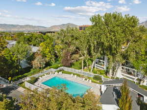Bird's eye view of a mountainous background and a pool area