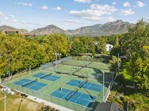 View of tennis court featuring a mountain view