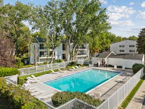 Community pool featuring a patio area