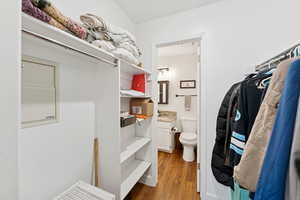 Half bath with vanity and dark wood-style floors