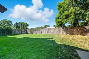 View of fenced backyard