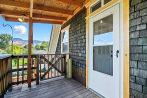 Wooden deck featuring a mountain view