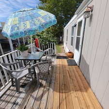 Wooden terrace with outdoor dining space