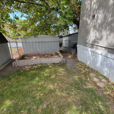 View of yard featuring a vegetable garden and an outdoor structure