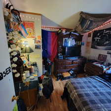 Bedroom with wood finished floors