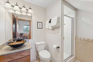 Bathroom with vanity and a shower stall