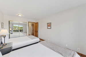 Bedroom with baseboards and a closet