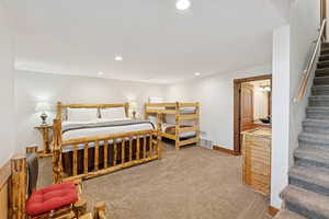 Bedroom featuring recessed lighting and light colored carpet