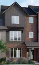 View of front of house with brick siding