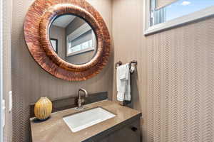 Half bathroom featuring vanity