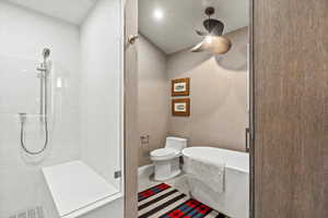 Full bathroom with a freestanding tub and a stall shower