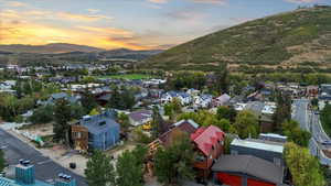 Aerial view of residential area with a mountain backdrop