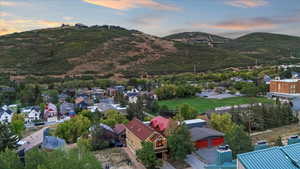 Aerial view at dusk of a mountain view and a residential view