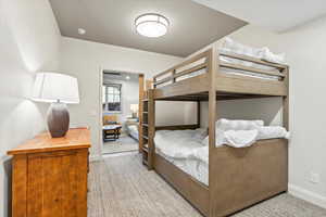 Bedroom with light colored carpet