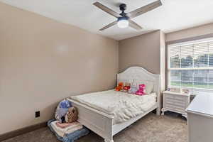 Bedroom with carpet flooring and ceiling fan