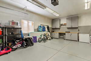 Garage featuring a garage door opener