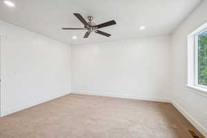 Unfurnished room with light carpet, recessed lighting, and ceiling fan