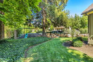 View of grassy yard with a playground