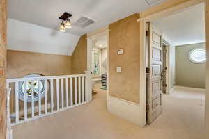 Bonus room with carpet and lofted ceiling
