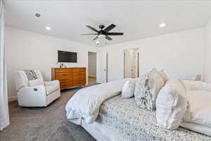 Carpeted bedroom with ceiling fan and recessed lighting