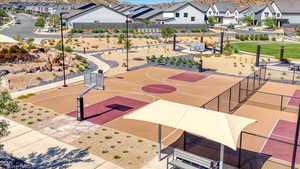 View of basketball court featuring a residential view and community basketball court