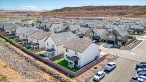 Aerial view of residential area featuring a mountain backdrop