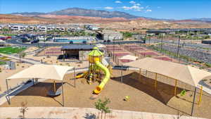Aerial perspective of suburban area featuring a mountain backdrop