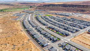 Aerial view of property's location featuring nearby suburban area and mountains