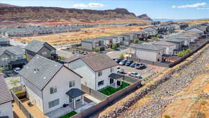Aerial view of residential area featuring a mountainous background