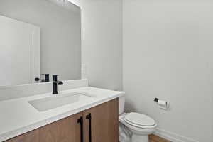 Bathroom with vanity and wood finished floors