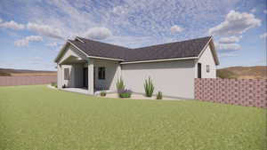 Back of property with a shingled roof, stucco siding, and a patio