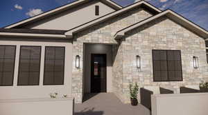 Property entrance with stone siding