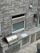 View of patio / terrace with an outdoor kitchen
