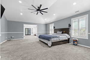 Bedroom featuring multiple windows, carpet flooring, recessed lighting, vaulted ceiling, and a ceiling fan