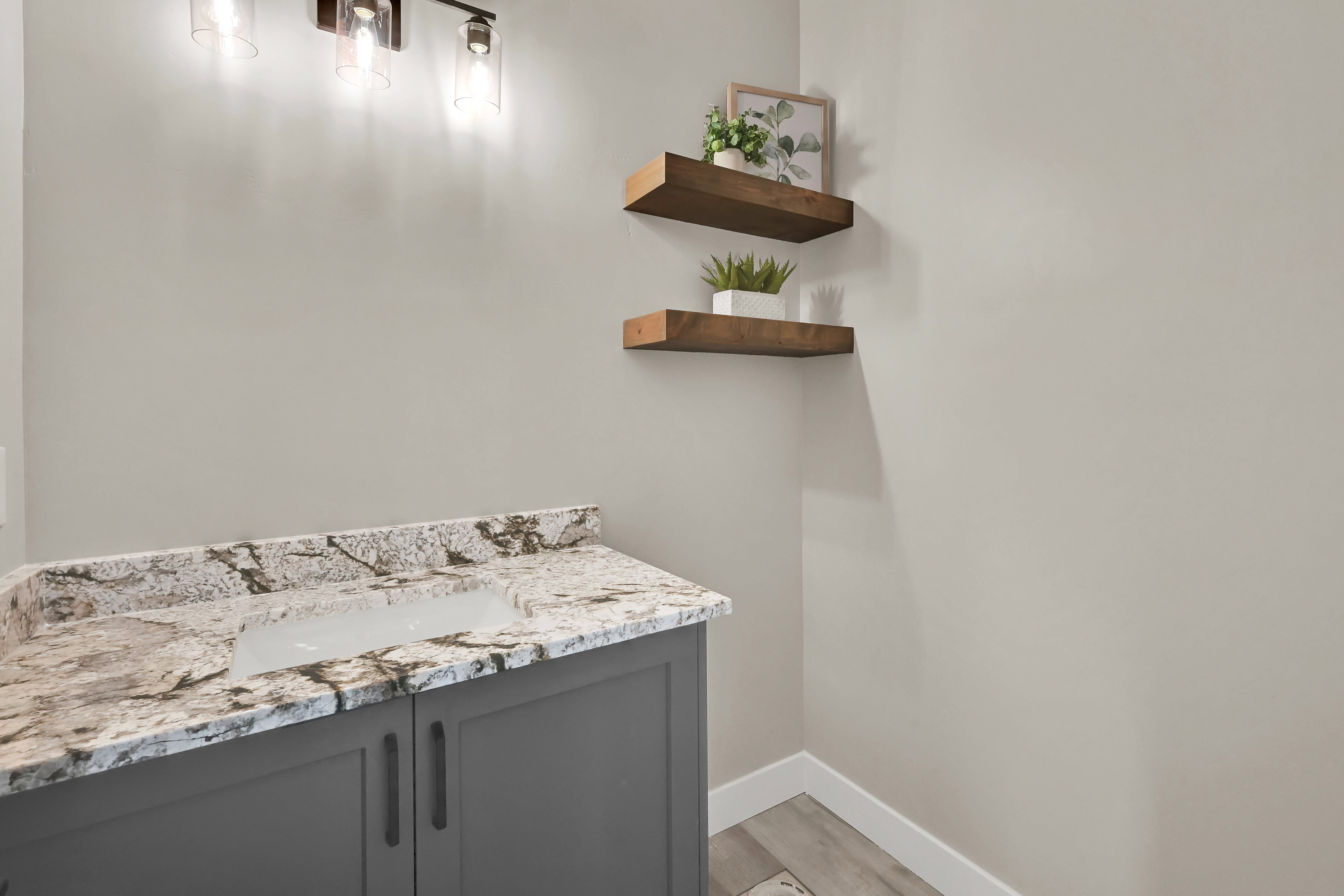 Bathroom with vanity and light wood-style floors