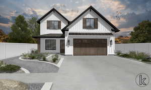 View of front of home with board and batten siding, driveway, a standing seam roof, a garage, and a metal roof