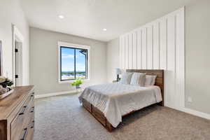 Bedroom with light carpet and recessed lighting