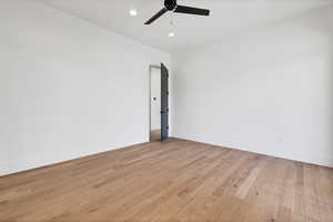 Spare room featuring light wood-type flooring, recessed lighting, and ceiling fan